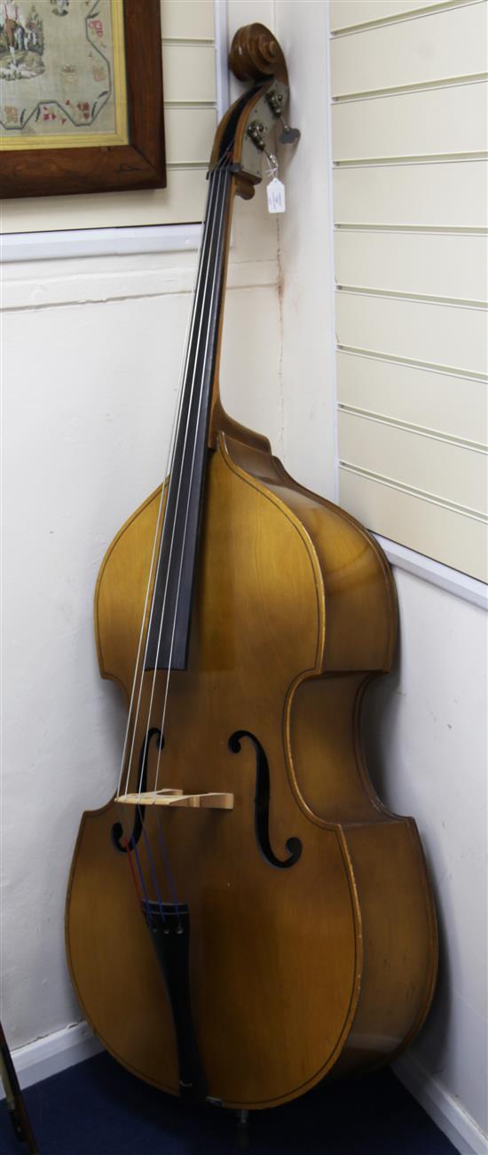 A 20th century Czechoslovakian three quarter size double bass, length of back 42in.